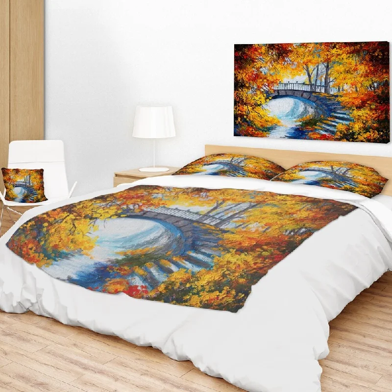 Cotton blankets for breathability and a lightweight feelDesignart 'Fall Forest with a Bridge' Landscape Fleece Throw Blanket