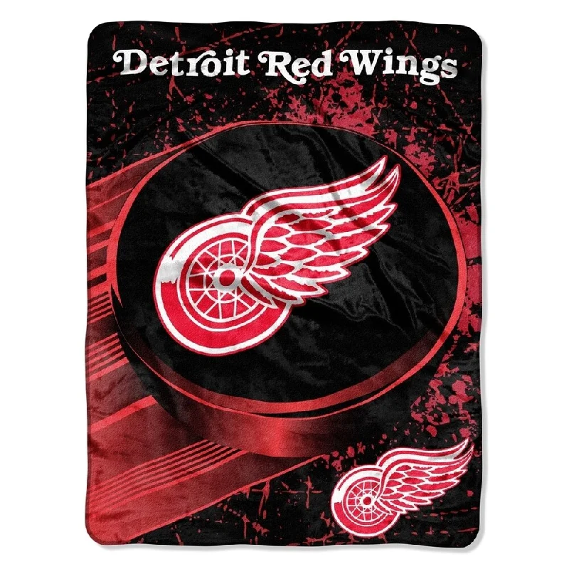 Microfiber blankets that are durable and easy to care forNHL 059 Red Wings Ice Dash Micro Throw